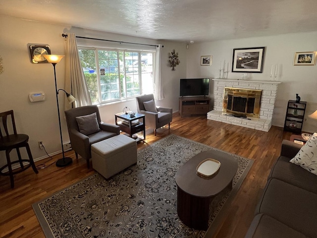 816 S Mamer Rd, Spokane Valley, WA 99216 - living area featuring wood finished floors and a stone fireplace