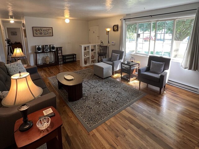 816 S Mamer Rd, Spokane Valley, WA 99216 - living room featuring wood finished floors and baseboard heating
