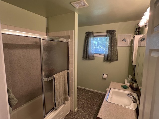 816 S Mamer Rd, Spokane Valley, WA 99216 - full bathroom featuring tile patterned floors, vanity, and bath / shower combo with glass door
