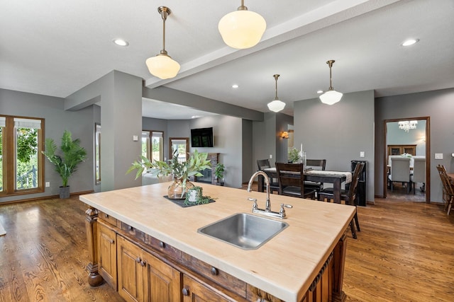 6204 E Custer Ln, Spokane, WA 99223 - kitchen featuring brown cabinets, wood finished floors, butcher block counters, open floor plan, and recessed lighting