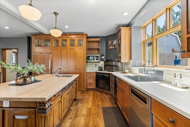 6204 E Custer Ln, Spokane, WA 99223 - kitchen with black appliances, healthy amount of natural light, brown cabinetry, recessed lighting, and beam ceiling