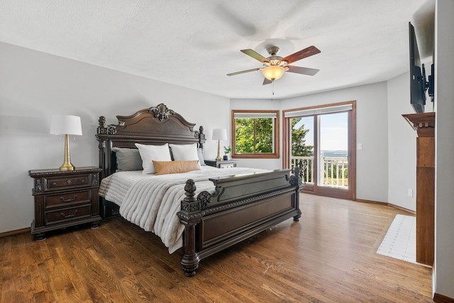 6204 E Custer Ln, Spokane, WA 99223 - bedroom featuring access to outside, wood finished floors, and ceiling fan