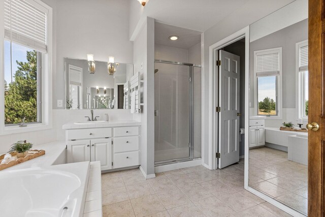 6204 E Custer Ln, Spokane, WA 99223 - bathroom with vanity, a stall shower, a garden tub, and tile patterned flooring