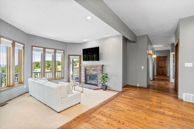 6204 E Custer Ln, Spokane, WA 99223 - living area with recessed lighting, a brick fireplace, and light wood-type flooring