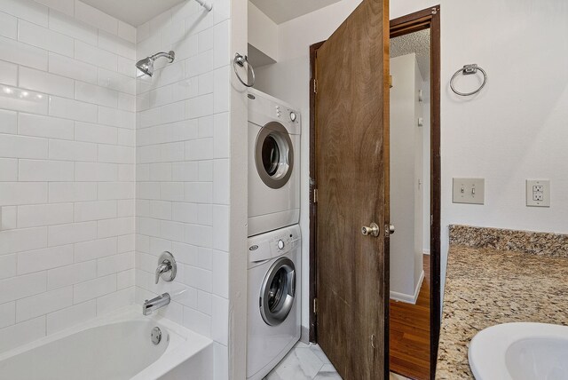 6125 N Addison St, Spokane, WA 99208 - bathroom with stacked washer / dryer and  shower combination