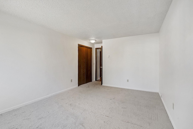 6125 N Addison St, Spokane, WA 99208 - spare room featuring light carpet and a textured ceiling