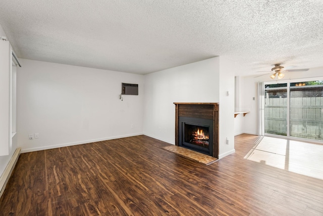 6125 N Addison St, Spokane, WA 99208 - unfurnished living room with a textured ceiling, wood finished floors, a fireplace with flush hearth, an AC wall unit, and ceiling fan