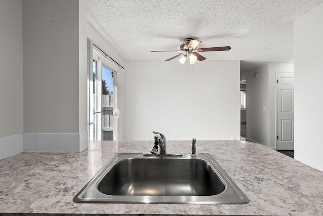 6125 N Addison St, Spokane, WA 99208 - kitchen featuring ceiling fan, a textured ceiling, and light countertops