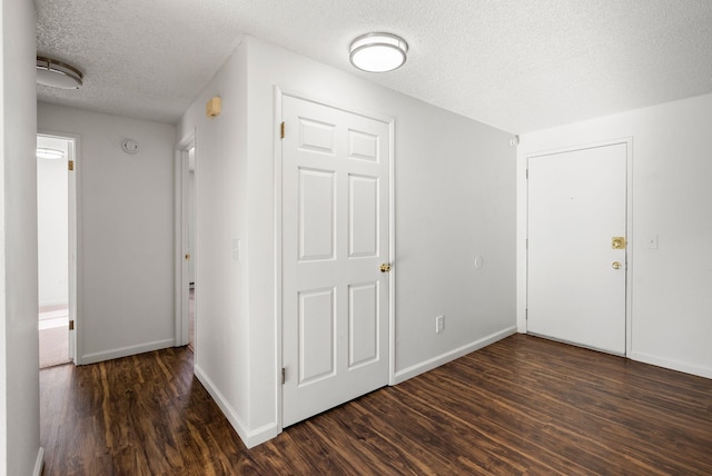6125 N Addison St, Spokane, WA 99208 - corridor with a textured ceiling and dark wood-style flooring