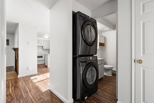 6125 N Addison St, Spokane, WA 99208 - laundry area featuring estacked washer and dryer and wood finished floors