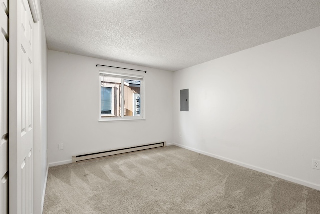 6125 N Addison St, Spokane, WA 99208 - carpeted empty room with a baseboard radiator, electric panel, and a textured ceiling