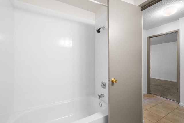 6125 N Addison St, Spokane, WA 99208 - bathroom with a textured ceiling,  shower combination, and tile patterned flooring