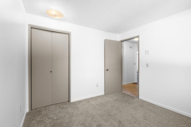 6125 N Addison St, Spokane, WA 99208 - unfurnished bedroom with carpet floors, a closet, and a textured ceiling