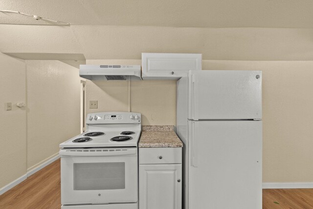 903 S Adams St, Spokane, WA 99204 - kitchen featuring white appliances, under cabinet range hood, light wood finished floors, and white cabinetry
