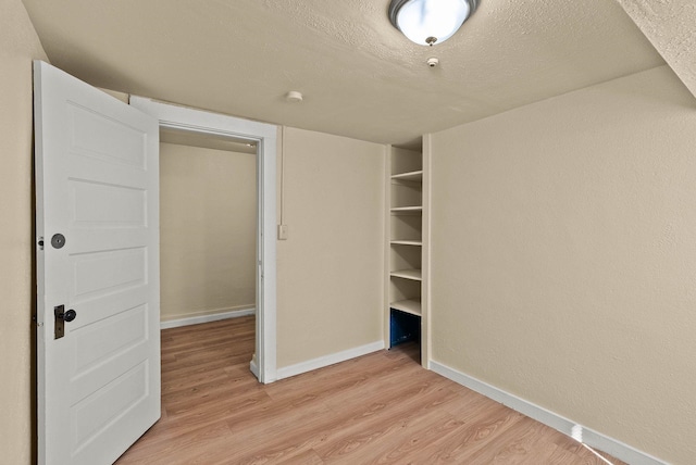 903 S Adams St, Spokane, WA 99204 - unfurnished bedroom featuring light wood finished floors and a textured ceiling