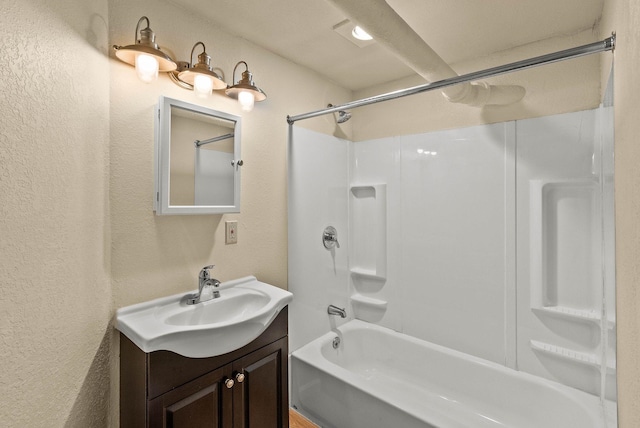 903 S Adams St, Spokane, WA 99204 - bathroom featuring a textured wall, vanity, and  shower combination