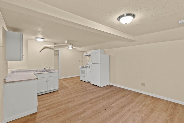 903 S Adams St, Spokane, WA 99204 - kitchen featuring white appliances, light wood-type flooring, light countertops, a textured ceiling, and a ceiling fan