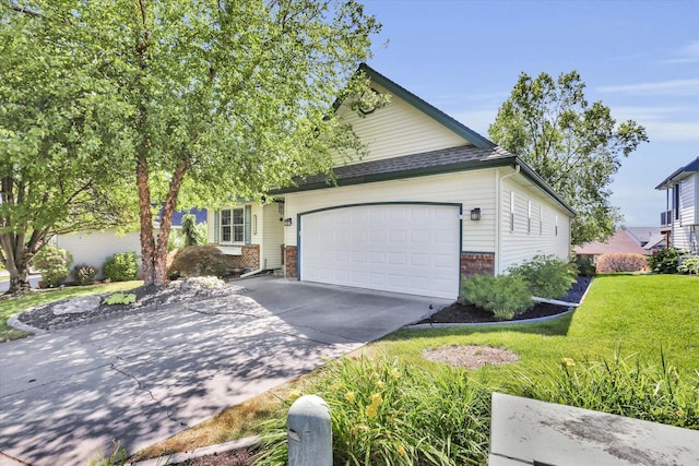 8722 E Boardwalk Ln, Spokane, WA 99212 - view of front facade with a garage, concrete driveway, brick siding, and a front lawn
