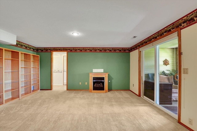 8722 E Boardwalk Ln, Spokane, WA 99212 - unfurnished living room featuring carpet and a glass covered fireplace