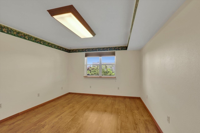 8722 E Boardwalk Ln, Spokane, WA 99212 - empty room with wood finished floors and baseboards