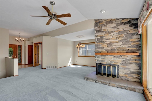 8722 E Boardwalk Ln, Spokane, WA 99212 - unfurnished living room featuring a chandelier, a fireplace, carpet flooring, ceiling fan, and vaulted ceiling