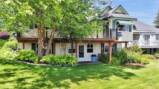 8722 E Boardwalk Ln, Spokane, WA 99212 - rear view of property with a lawn and a wooden deck