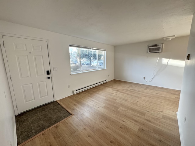 824-830 E N Ave, Spokane, WA 99207 - foyer entrance with a baseboard radiator, wood finished floors, and a wall mounted air conditioner