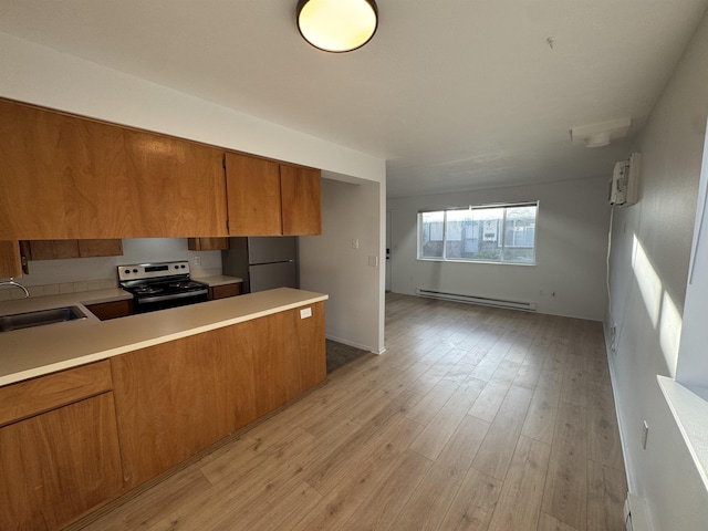 824-830 E N Ave, Spokane, WA 99207 - kitchen featuring stainless steel range with electric cooktop, a baseboard heating unit, brown cabinetry, light countertops, and light wood-type flooring