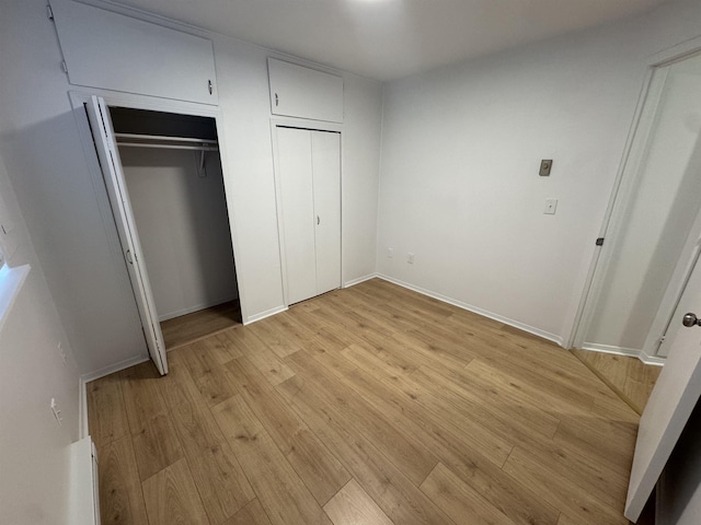 824-830 E N Ave, Spokane, WA 99207 - unfurnished bedroom with light wood-style flooring and baseboards