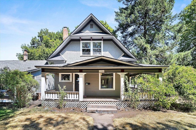 1304 W 15th Ave, Spokane, WA 99203 - view of front facade featuring a porch and a chimney