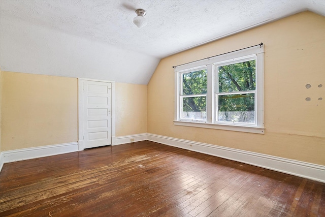 1304 W 15th Ave, Spokane, WA 99203 - additional living space featuring vaulted ceiling, wood-type flooring, and a textured ceiling