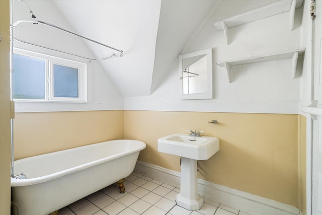 1304 W 15th Ave, Spokane, WA 99203 - bathroom featuring vaulted ceiling, a soaking tub, and tile patterned floors