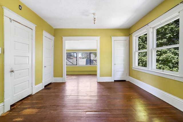 1304 W 15th Ave, Spokane, WA 99203 - unfurnished dining area with healthy amount of natural light and dark wood-style floors