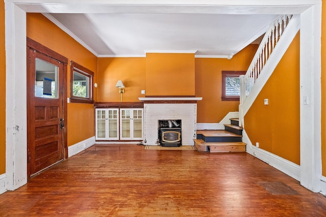 1304 W 15th Ave, Spokane, WA 99203 - unfurnished living room with wood finished floors, stairs, ornamental molding, and a wood stove