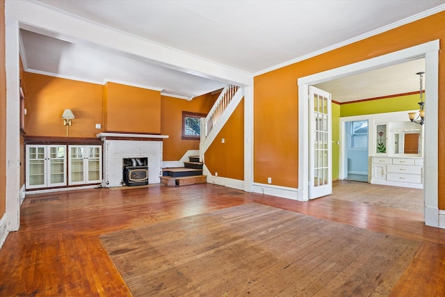 1304 W 15th Ave, Spokane, WA 99203 - unfurnished living room with crown molding, hardwood / wood-style flooring, stairway, and a chandelier