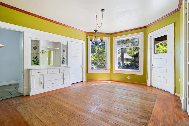 1304 W 15th Ave, Spokane, WA 99203 - unfurnished dining area featuring a chandelier, crown molding, and hardwood / wood-style flooring