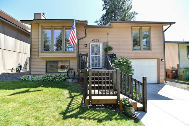4232 E 10th Ave, Spokane, WA 99202 - view of front facade with a garage, concrete driveway, and a front lawn