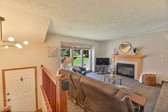 4232 E 10th Ave, Spokane, WA 99202 - living area with carpet floors, a chandelier, a glass covered fireplace, and a textured ceiling