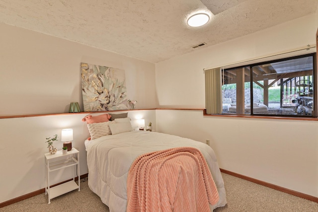 4232 E 10th Ave, Spokane, WA 99202 - bedroom with carpet flooring and a textured ceiling