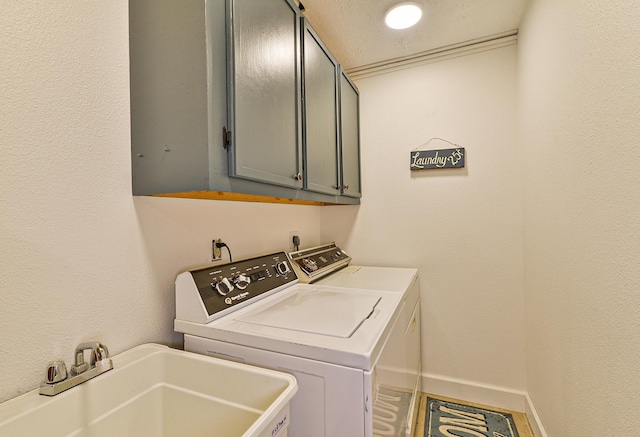 4232 E 10th Ave, Spokane, WA 99202 - washroom with cabinet space and washing machine and dryer