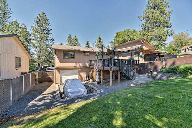 4232 E 10th Ave, Spokane, WA 99202 - back of house with stairs, a deck, and a garage