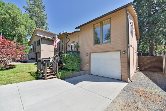 4232 E 10th Ave, Spokane, WA 99202 - view of front of house featuring a garage and driveway