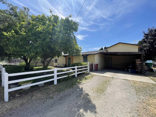 17816 E 2nd Ave, Greenacres, WA 99016 - ranch-style house with dirt driveway and a carport