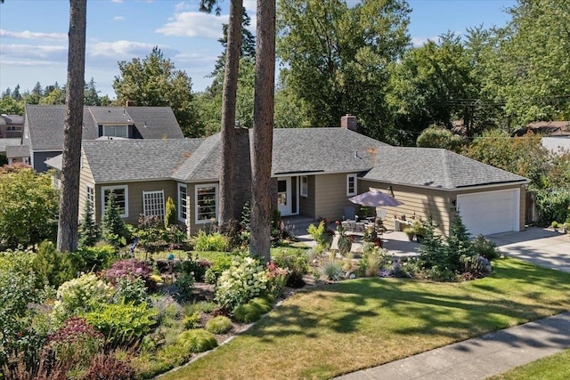2718 S Hatch St, Spokane, WA 99203 - view of front of home with driveway, a front lawn, an attached garage, a chimney, and a shingled roof