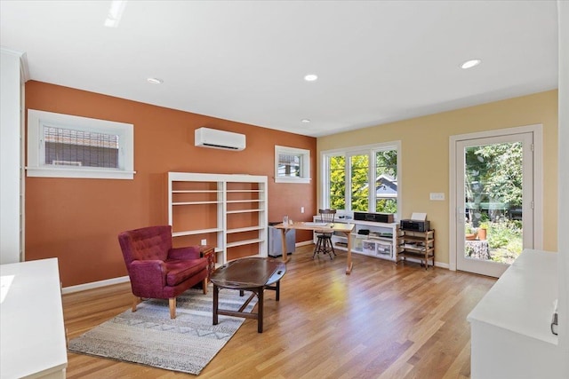 2718 S Hatch St, Spokane, WA 99203 - sitting room with a wall mounted AC, light wood-style floors, and recessed lighting
