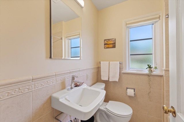 2718 S Hatch St, Spokane, WA 99203 - full bath with tile walls, a wainscoted wall, and a shower