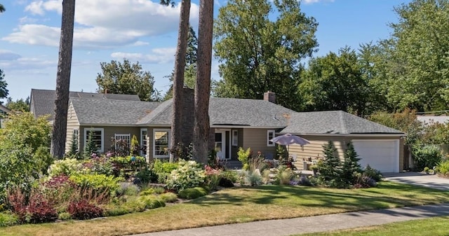 2718 S Hatch St, Spokane, WA 99203 - ranch-style house with a garage, a front yard, concrete driveway, and a chimney