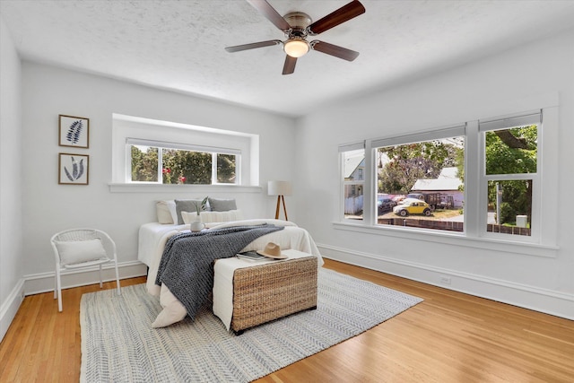 2116 N Jefferson St, Spokane, WA 99205 - bedroom featuring multiple windows, wood finished floors, and ceiling fan