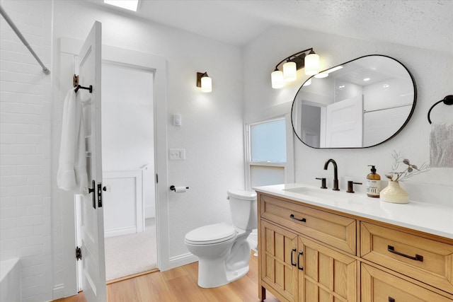 2116 N Jefferson St, Spokane, WA 99205 - bathroom with wood finished floors, vanity, vaulted ceiling, and shower / bath combination
