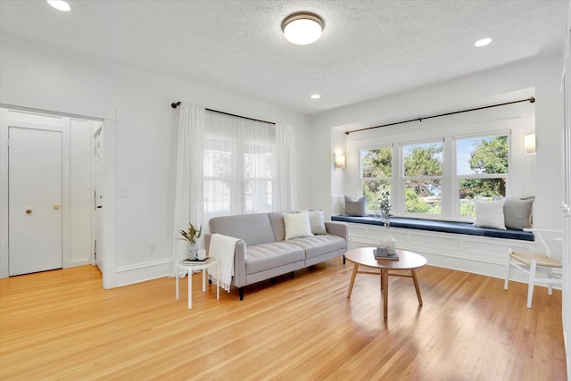2116 N Jefferson St, Spokane, WA 99205 - living room with light wood finished floors, a textured ceiling, and recessed lighting
